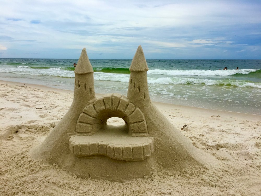 Sandcastle with archway and twin towers