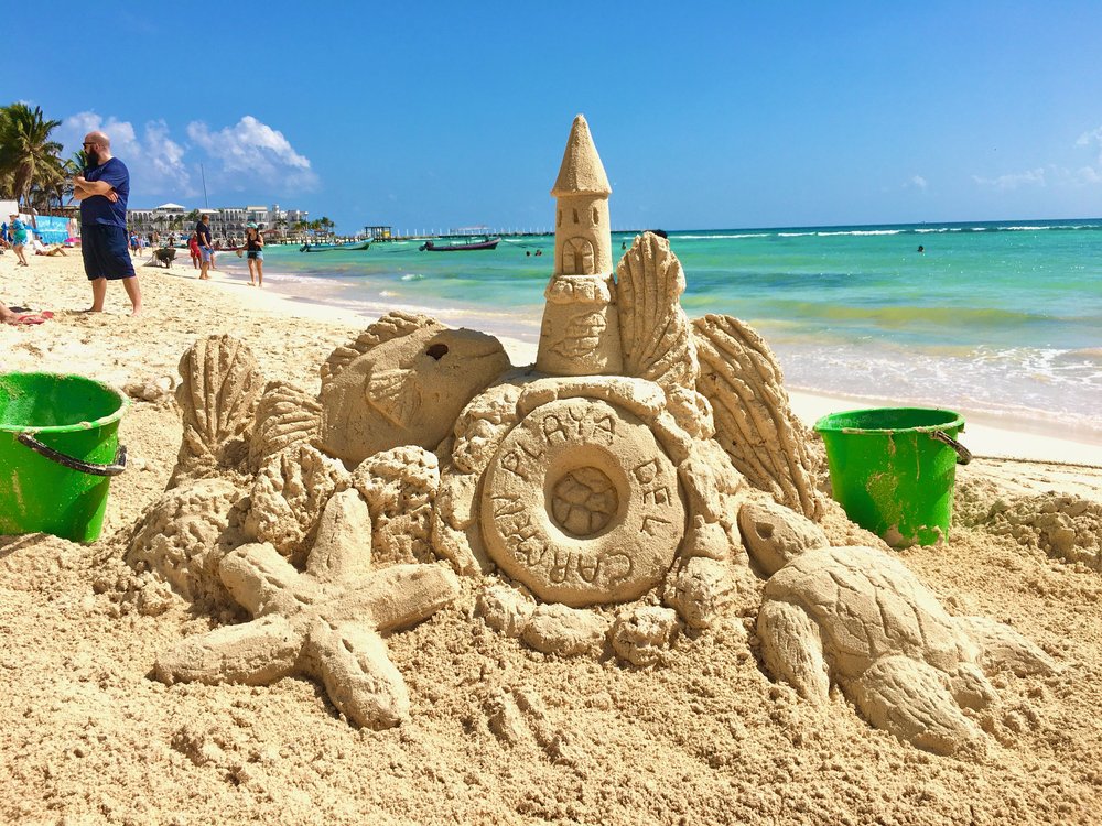 Sandcastle sculpture with sea turtles at Playa del Carmen